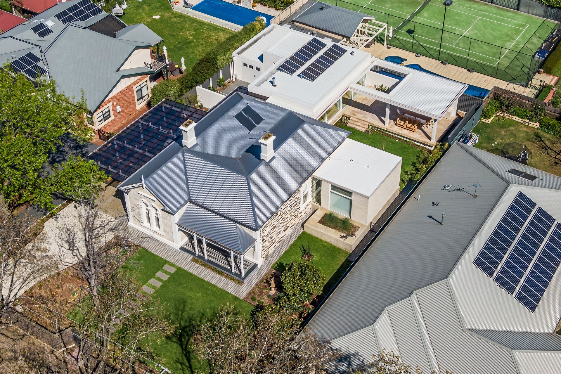 Aerial view renovated classic Australian sandstone villa with contemporary extension